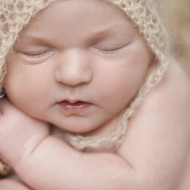 Newborn photo of a baby girl sleeping