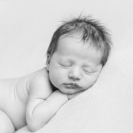 Cute little newborn sleeping on tummy