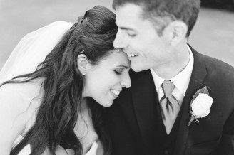 B&W image of a fun wedding couple