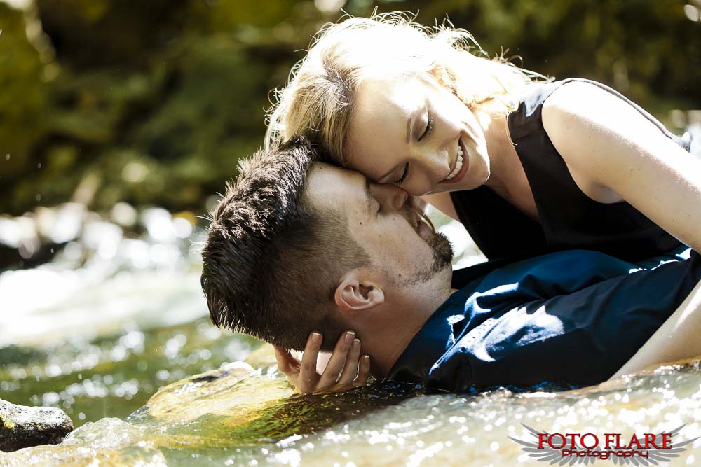 Couple laying in water