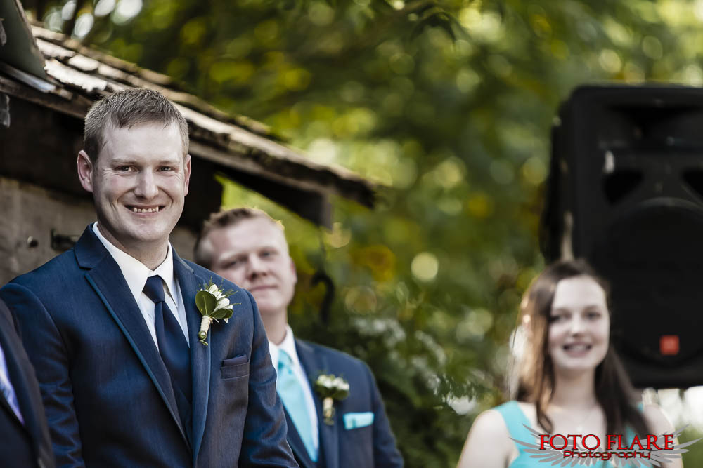 Grooms first look at bride during ceremony