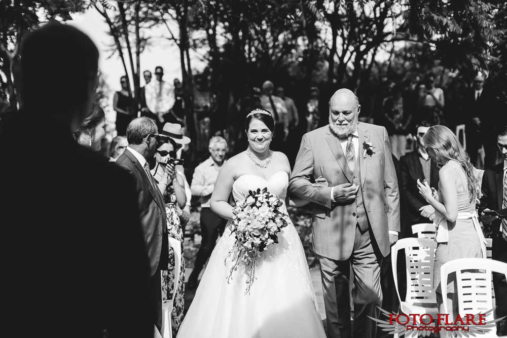 The bride walking with her father