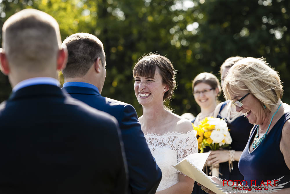 Bride laughing during wedding ceremony