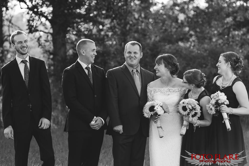 Candid photo of the wedding party laughing