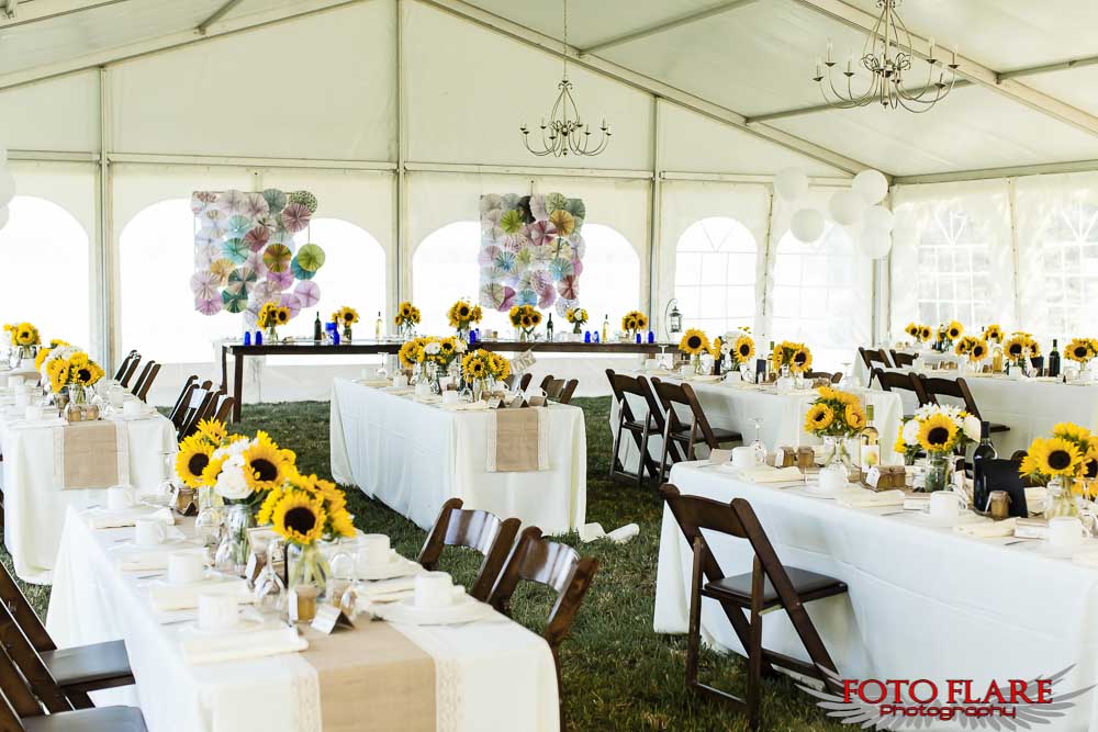 Country wedding reception decor in a tent