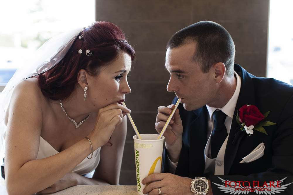 Bride and groom sharing drink