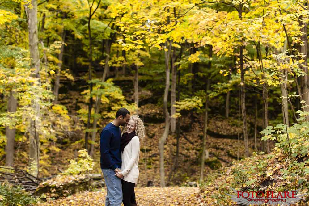 Fall colours in the backdrop of engagement pictures