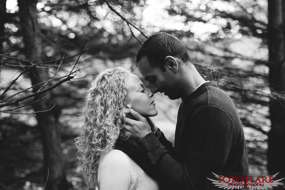 B&W photo of a couple in the forest