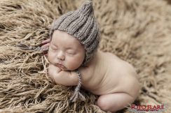 Newborn baby sleeping on furry blanket