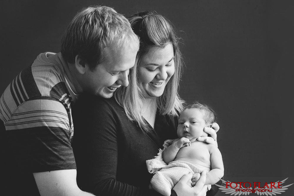 B&W family photo with newborn
