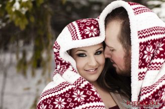 Winter engagement photos with a blanket