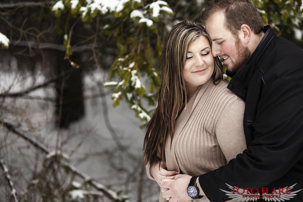 Beautiful winter engagement in a forest