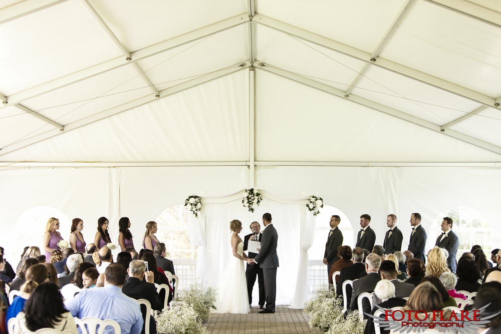 Wedding ceremony in the rose garden tent