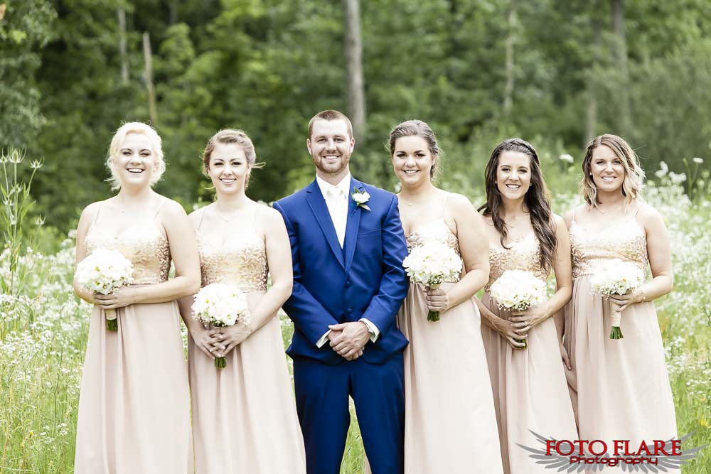 Bridesmaids with groom