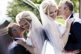 Rylan kissing Jo-Ellen with reflection in limo