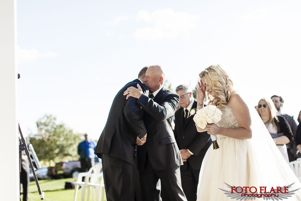 Groom hugging father-in-law