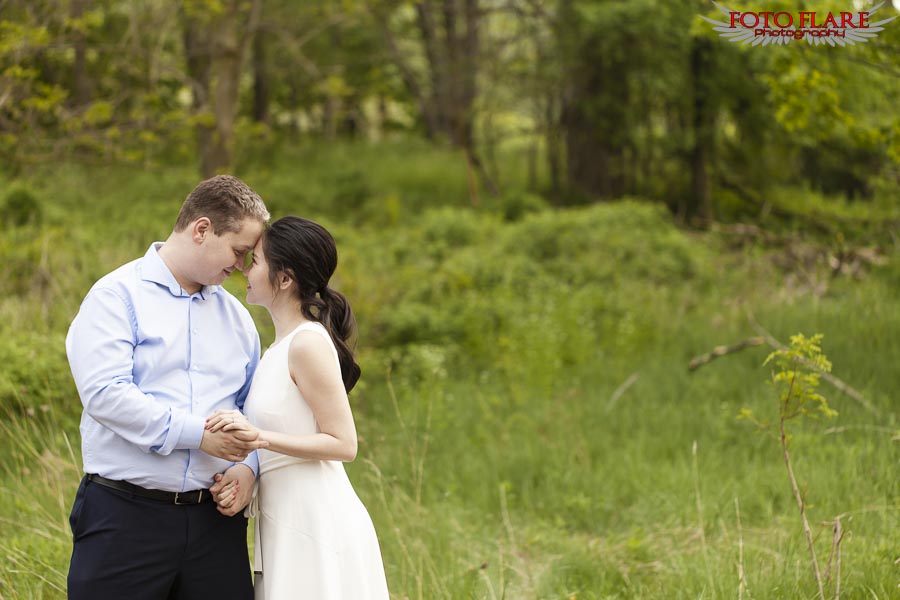 Couple in open field engagement